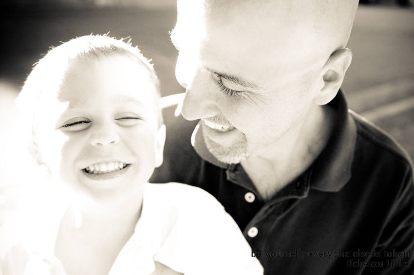 photograph of father and son laughing