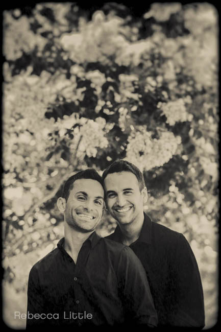 Black and white photograph of same sex couple in Pasadena CA in love among the flowers