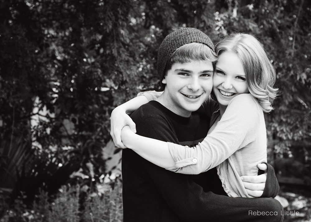 Black and white photo of brother and sister hugging natural relaxed family lifestyle portraits in Sierra Madre La Canada San Marino South Pasadena and Los Angeles Rebecca Little Photography in Pasadena CA